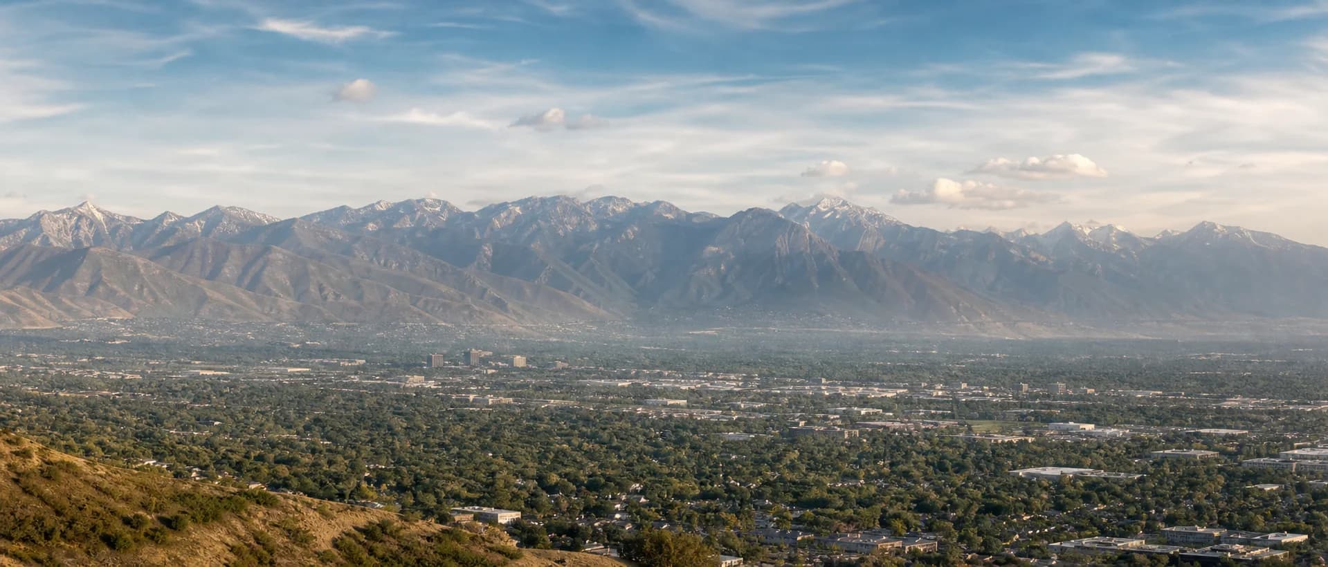 Illustrative distant view across the Salt Lake Valley toward the Wasatch Front